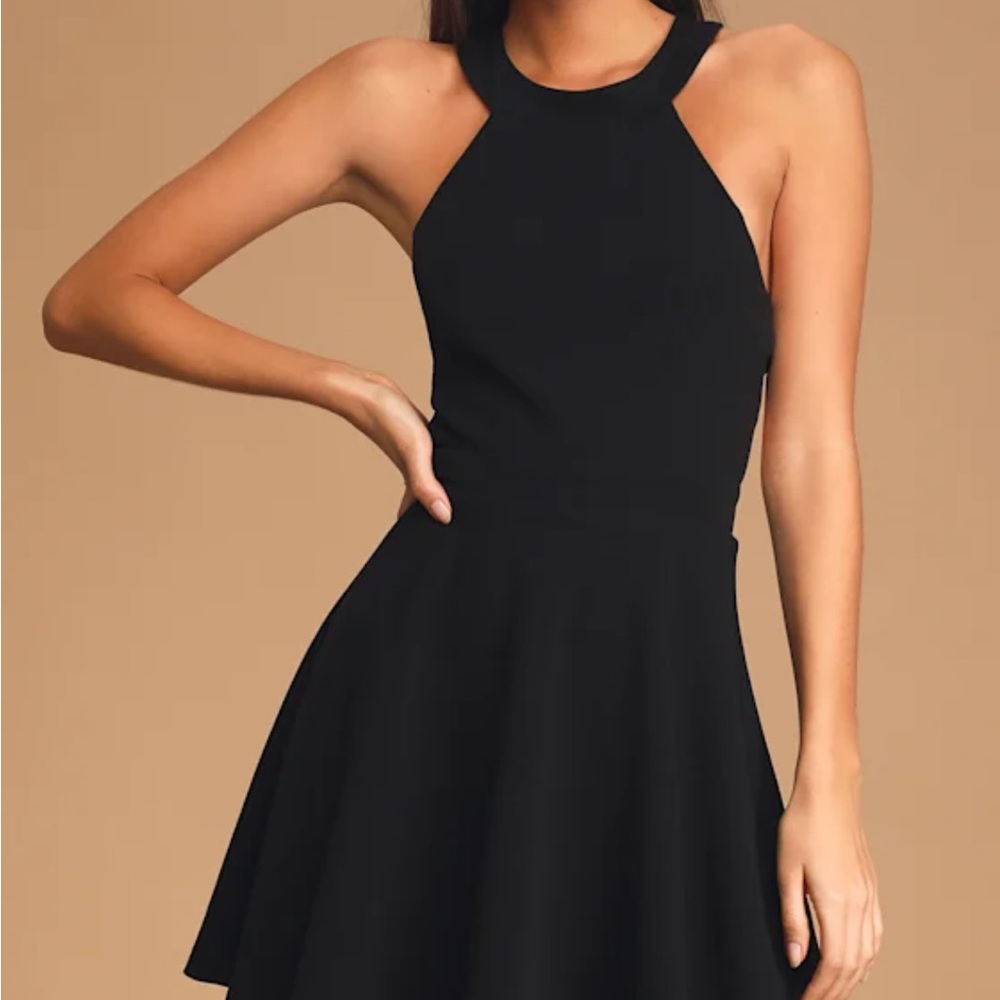 NWT Lulu’s black skater dress with strappy back.  Size Medium. Never worn